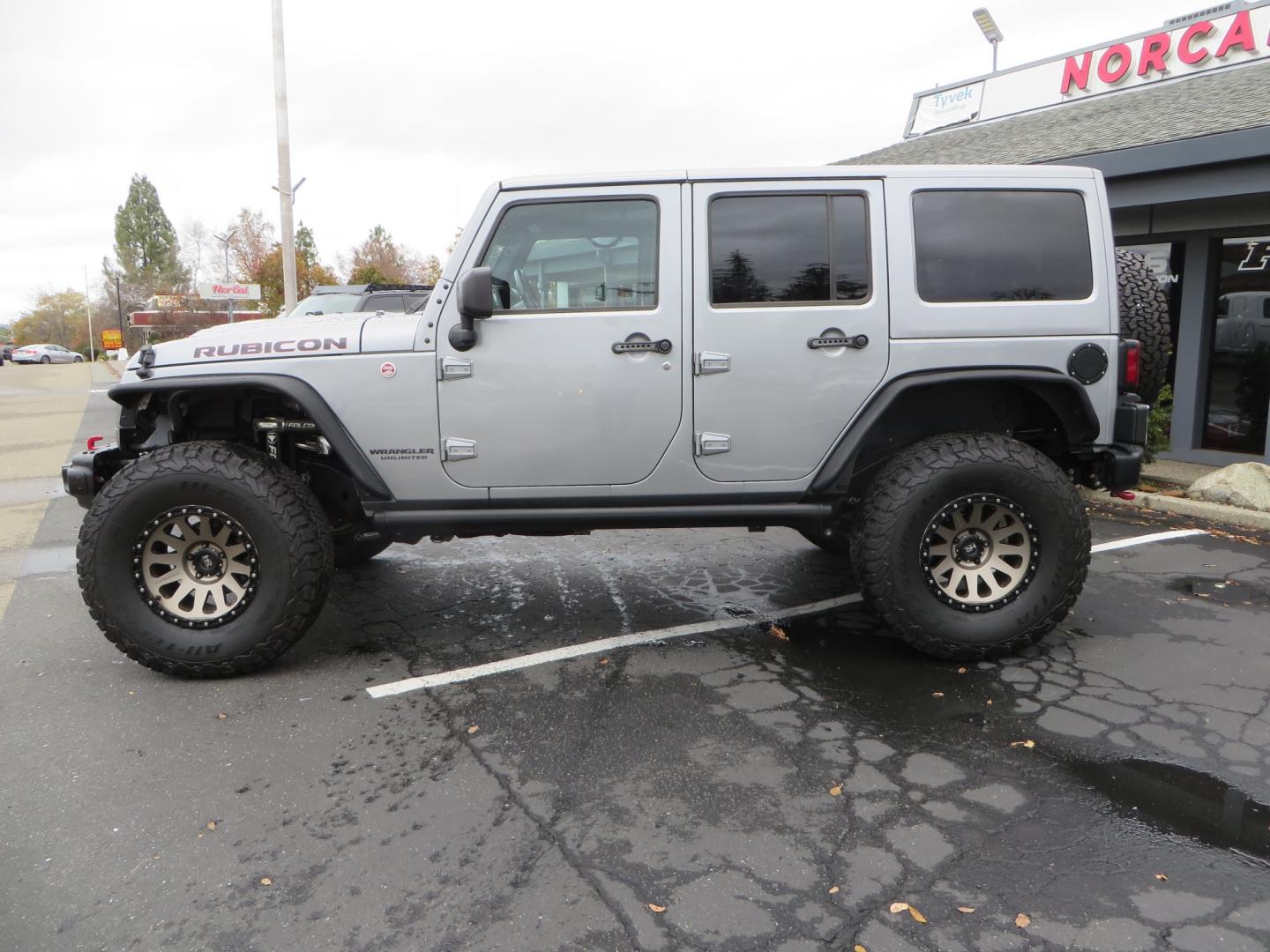 2017 SILVER /BLACK Jeep Wrangler Unlimited Rubicon 4WD (1C4BJWFG3HL) with an 3.6L V6 DOHC 24V FFV engine, automatic transmission, located at 2630 Grass Valley Highway, Auburn, CA, 95603, (530) 508-5100, 38.937893, -121.095482 - Rubicon sitting on a Teraflex suspension system, Falcon shocks, 37" BFG KO2 tires, 17" Hardrock wheels, RC Fender Flares, and AMP steps. - Photo#7